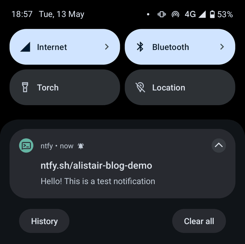 Screenshot of android notification menu with a notification from ntfy. It has a title of ntfy.sh/alistair-blog-demo, and body of 'Hello! This is a test notification'